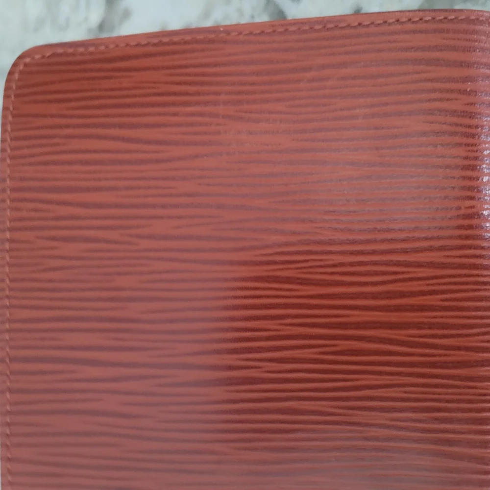 Louis Vuitton Brown Wallet with Elegant Embossed Texture
